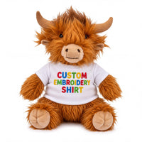 A stuffed toy animal, specifically a brown cow, wearing a white t-shirt with the text "CUSTOM EMBROIDERY SHIRT" printed on it.