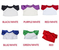 six different t-shirt designs in various colors, including black/white, purple/white, red/white, blue/white, green/white, and red.