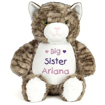 A stuffed cat toy with a white belly and brown stripes.