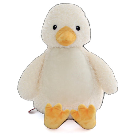 A white stuffed duck toy with yellow feet and a yellow beak.