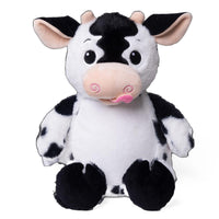 A stuffed cow toy with a black and white pattern and pink accents.