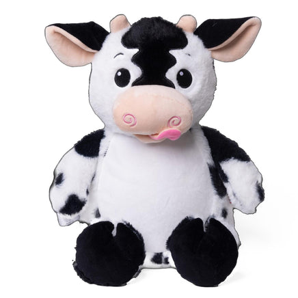 A stuffed cow toy with a black and white pattern and pink accents.
