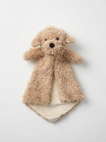 A brown teddy bear with a black nose and eyes is lying on a white background.